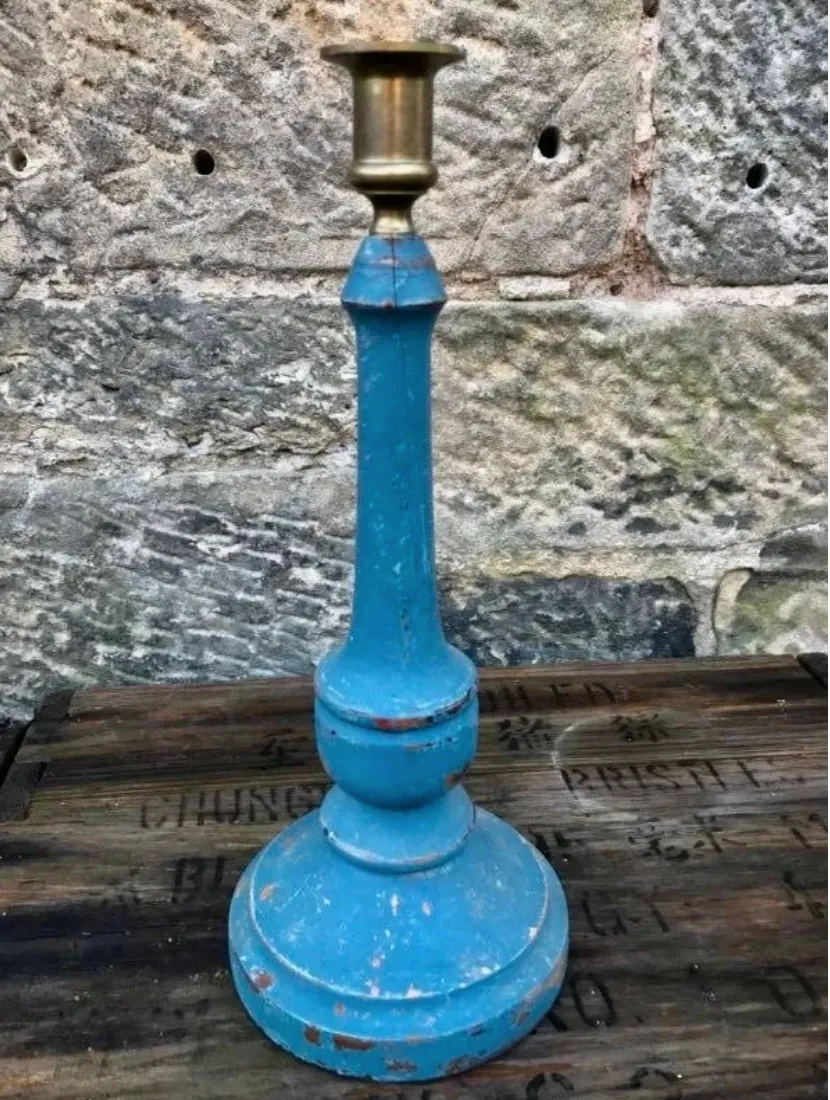 Vintage wooden candlestick painted in layers of pink and blue milk paint