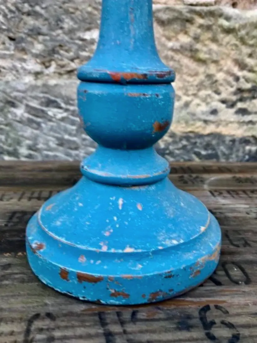 Vintage wooden candlestick painted in layers of pink and blue milk paint